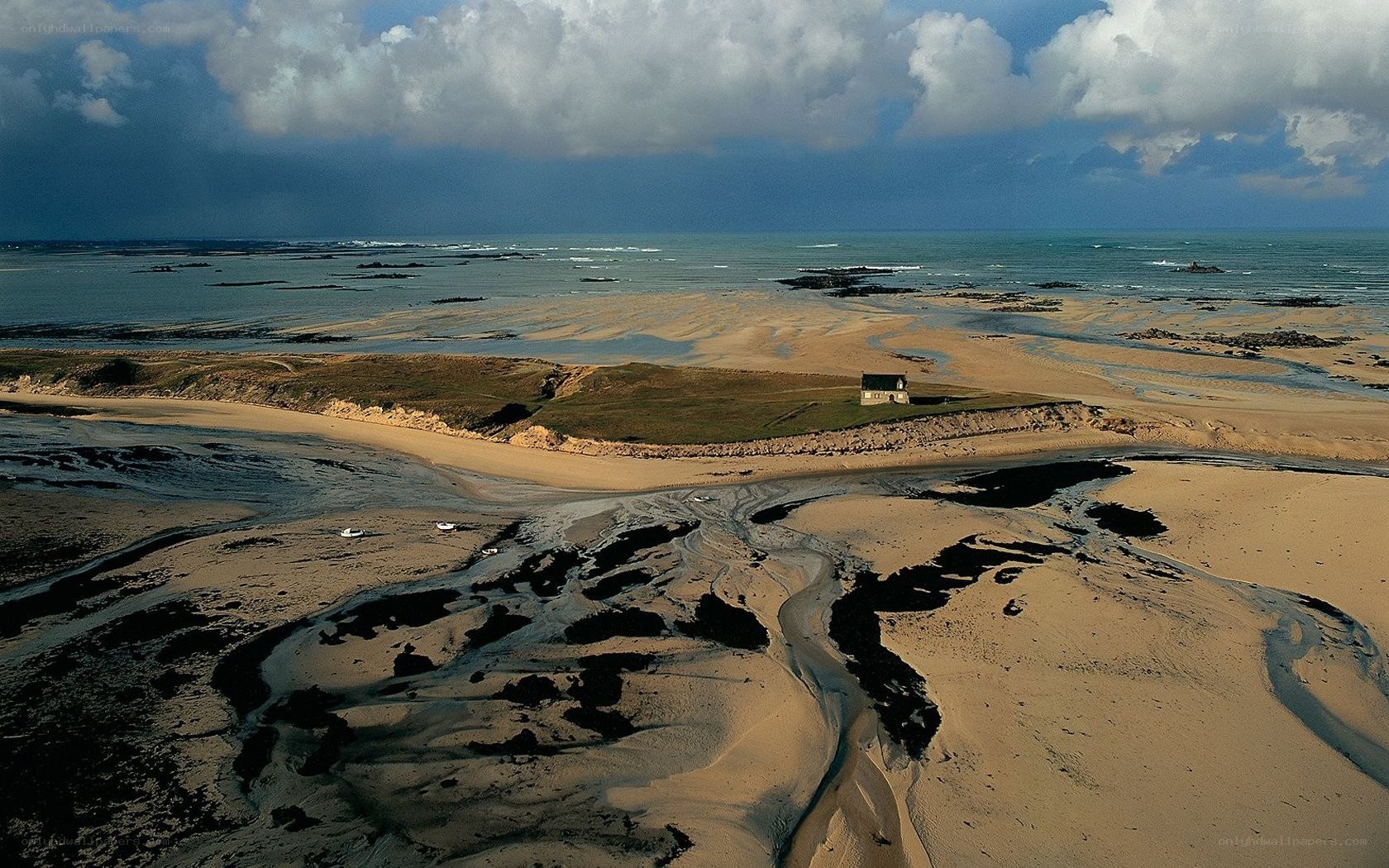 Coastal landscape with small house