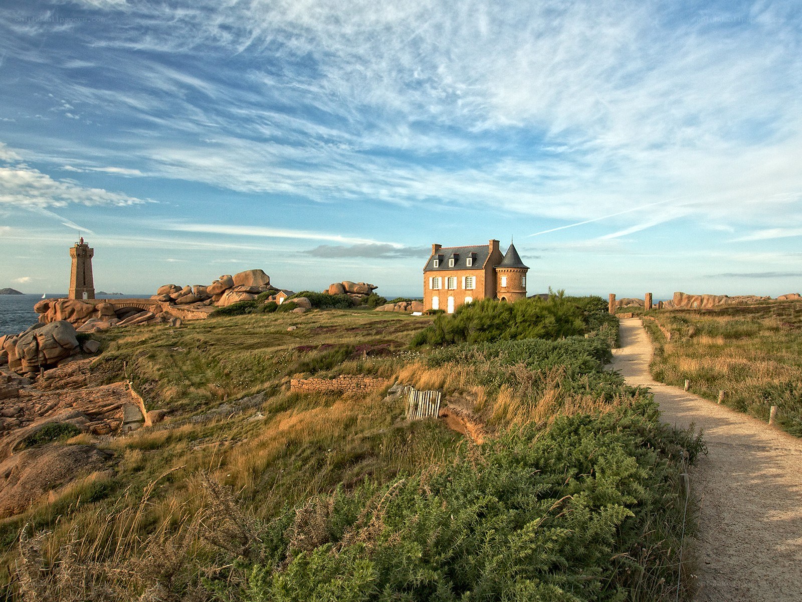 Coastal lighthouse and house