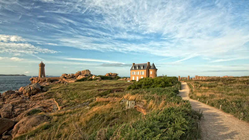 Coastal lighthouse and house