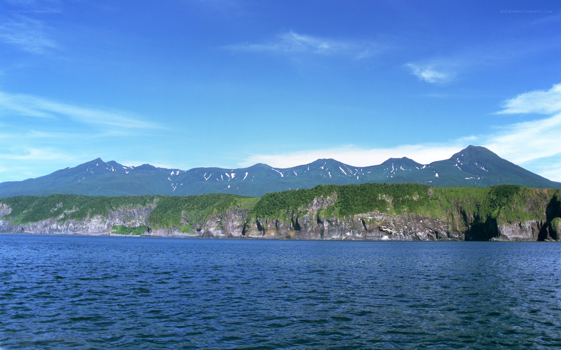 coastal mountains under blue sky