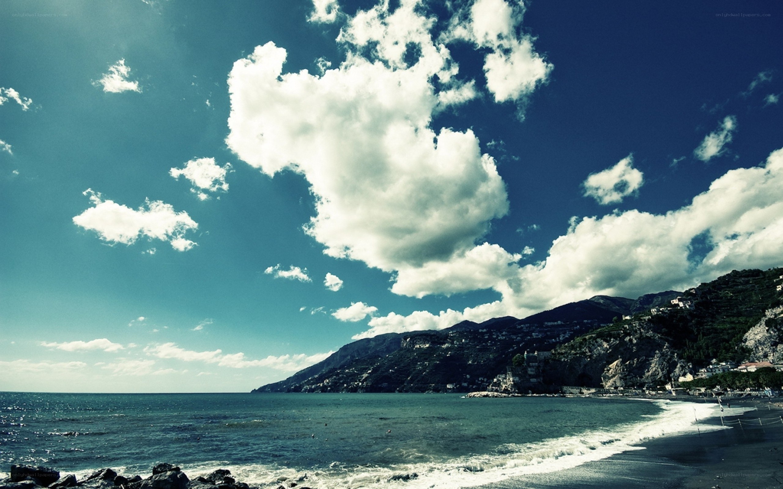 coastal mountains under cloudy sky