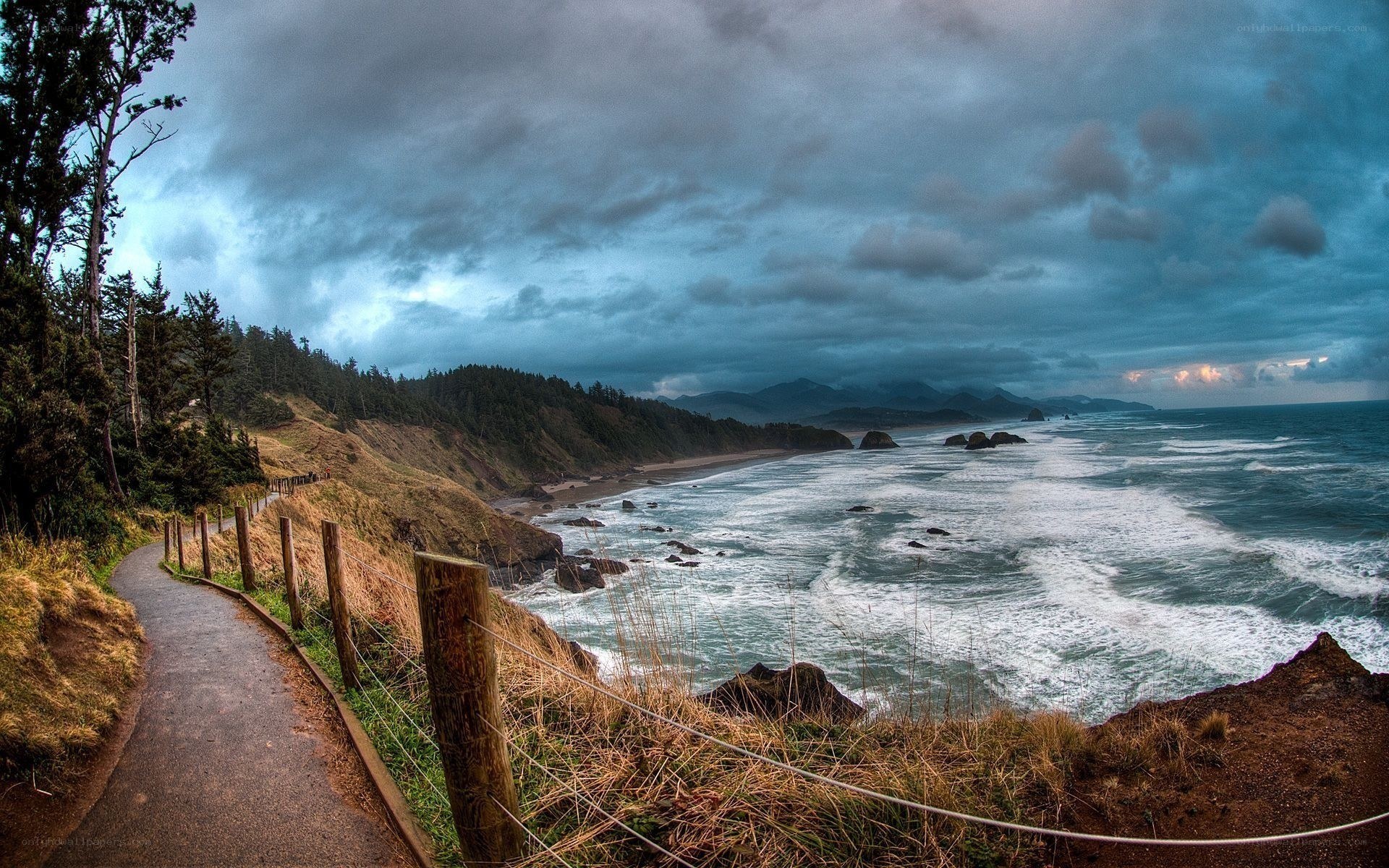 Coastal path under stormy sky