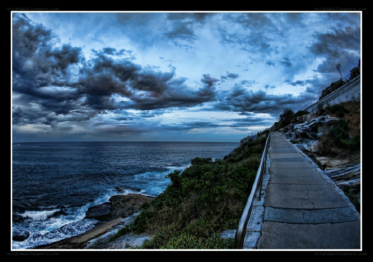 Coastal path under stormy sky