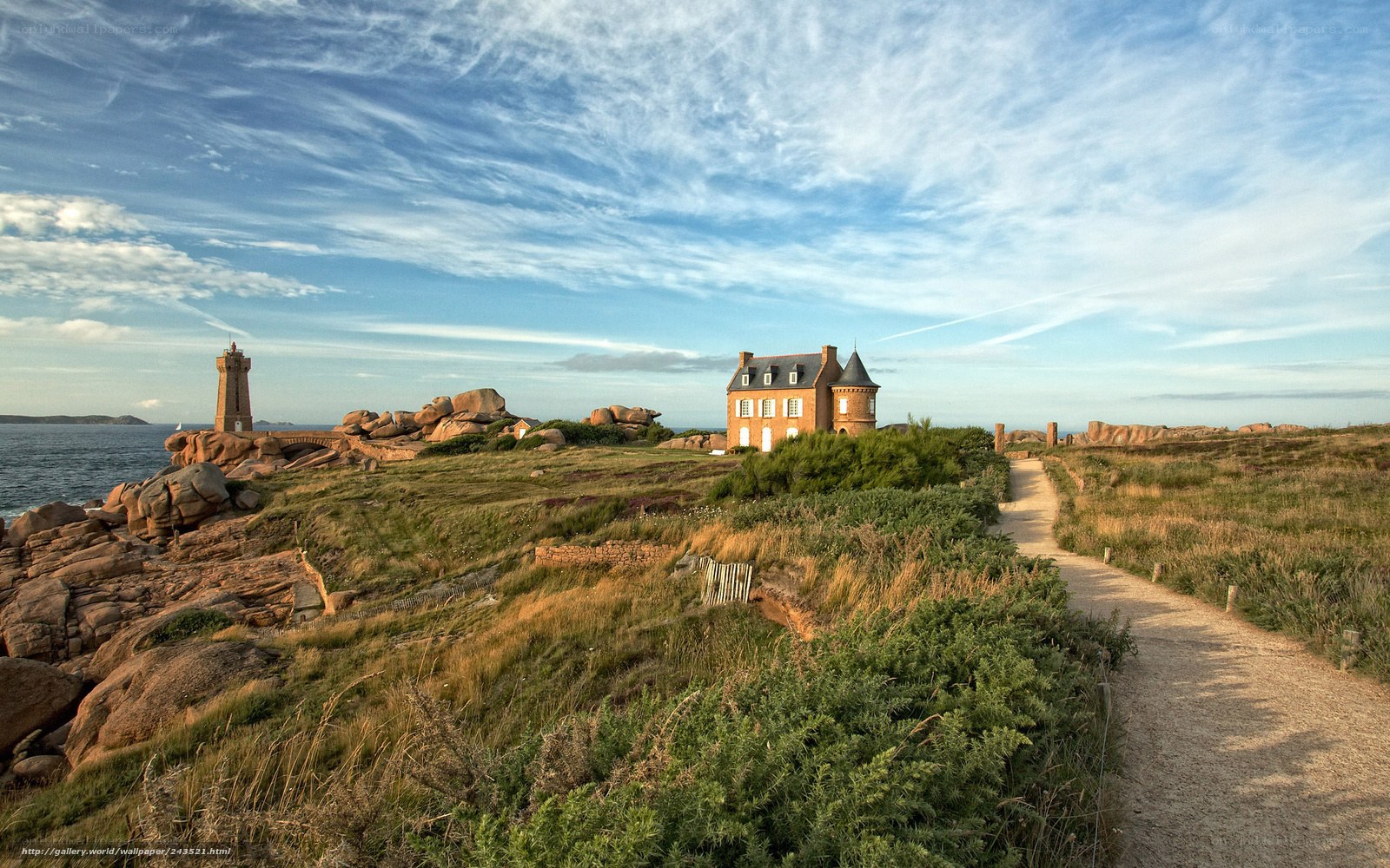 Coastal path with lighthouse and house