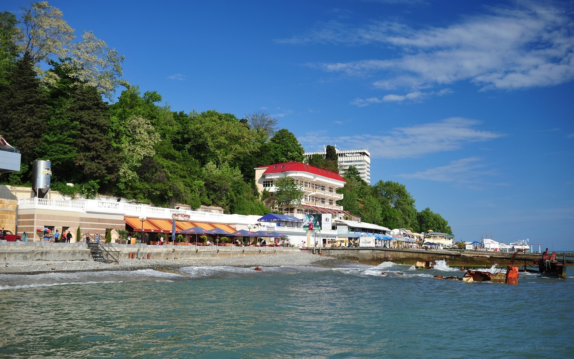 Coastal resort with red-roofed building