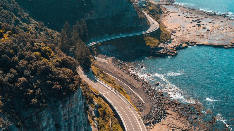 Coastal Road Along Cliffs — Blue, Dramatic