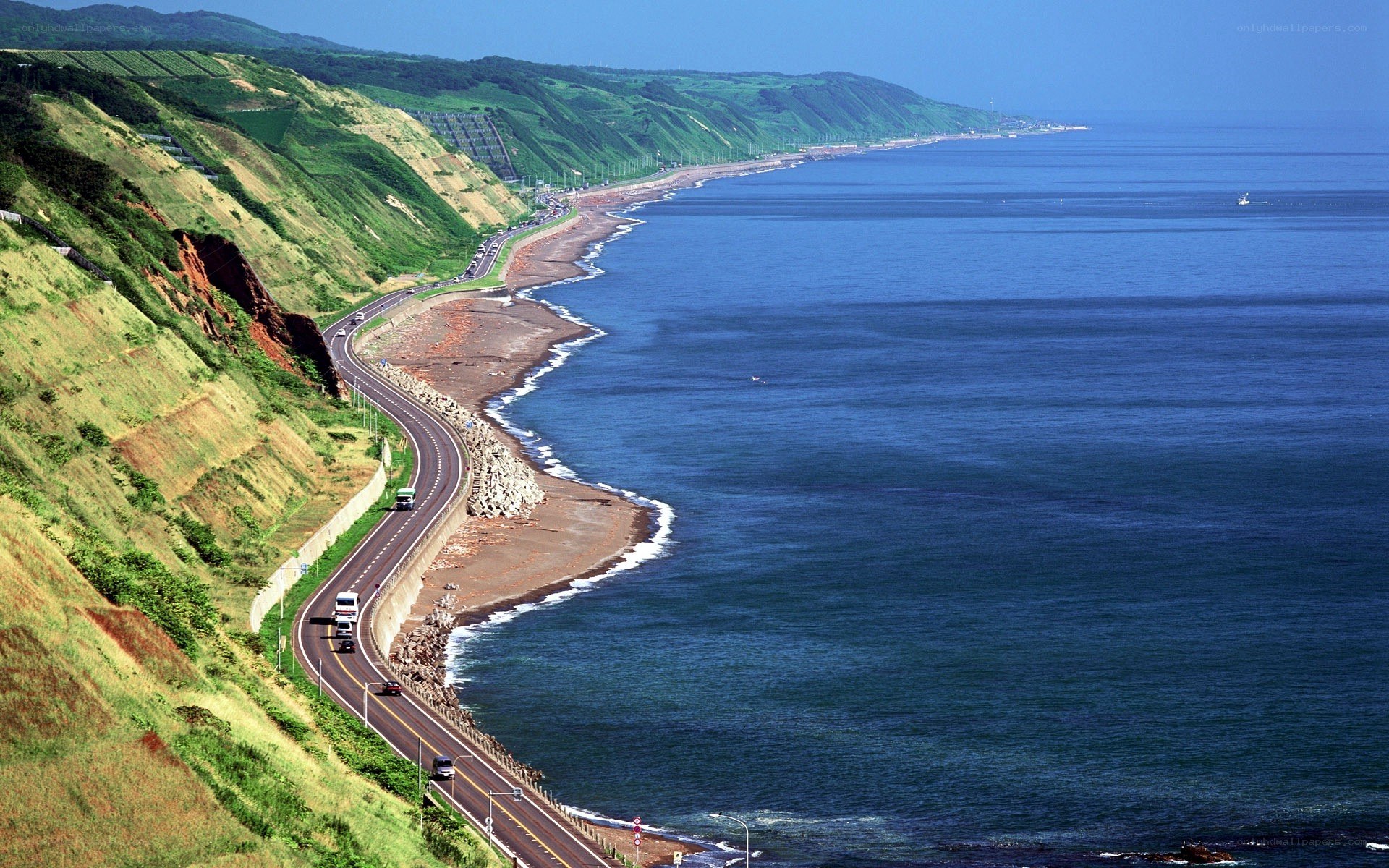 coastal road along green cliffs