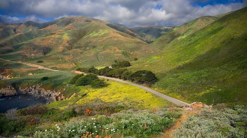 coastal road through green hills