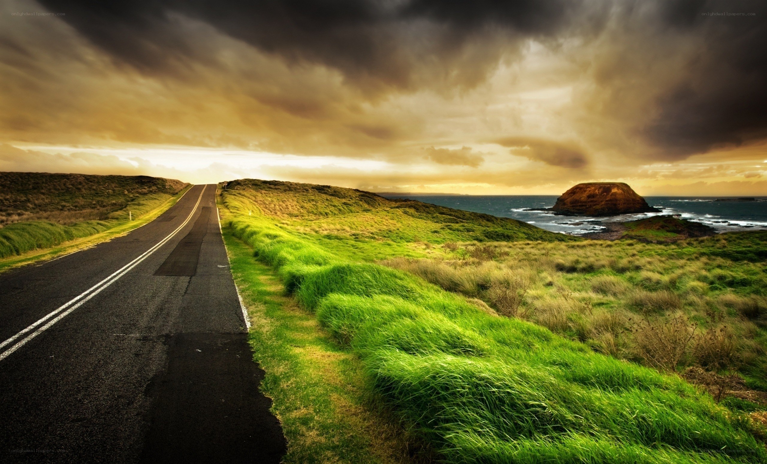 Coastal road under stormy sky
