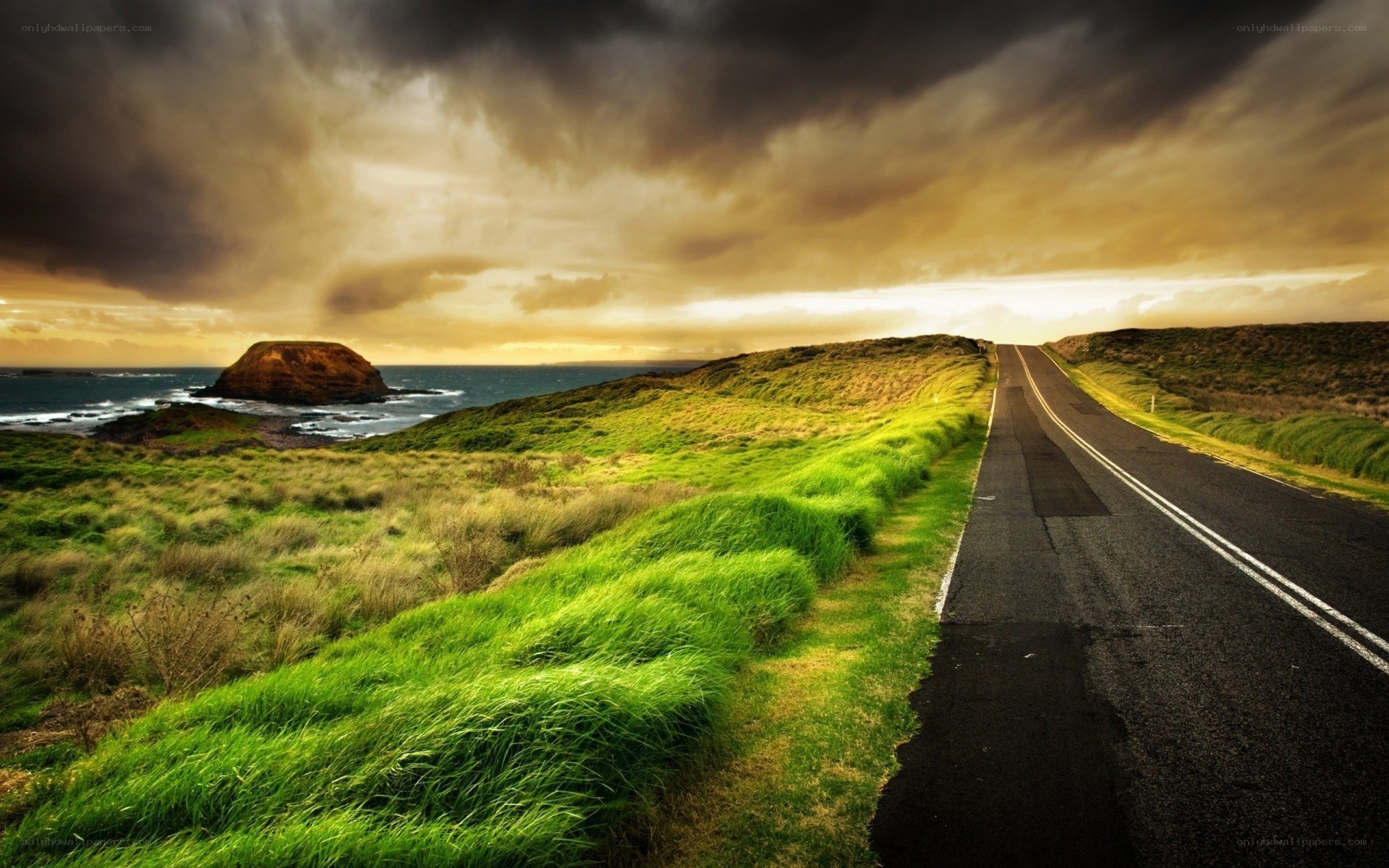 Coastal road under stormy sky