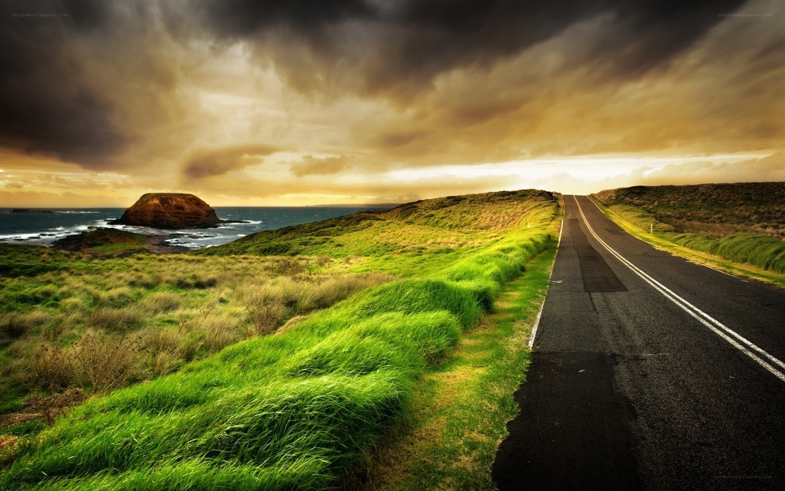 Coastal road under stormy sky