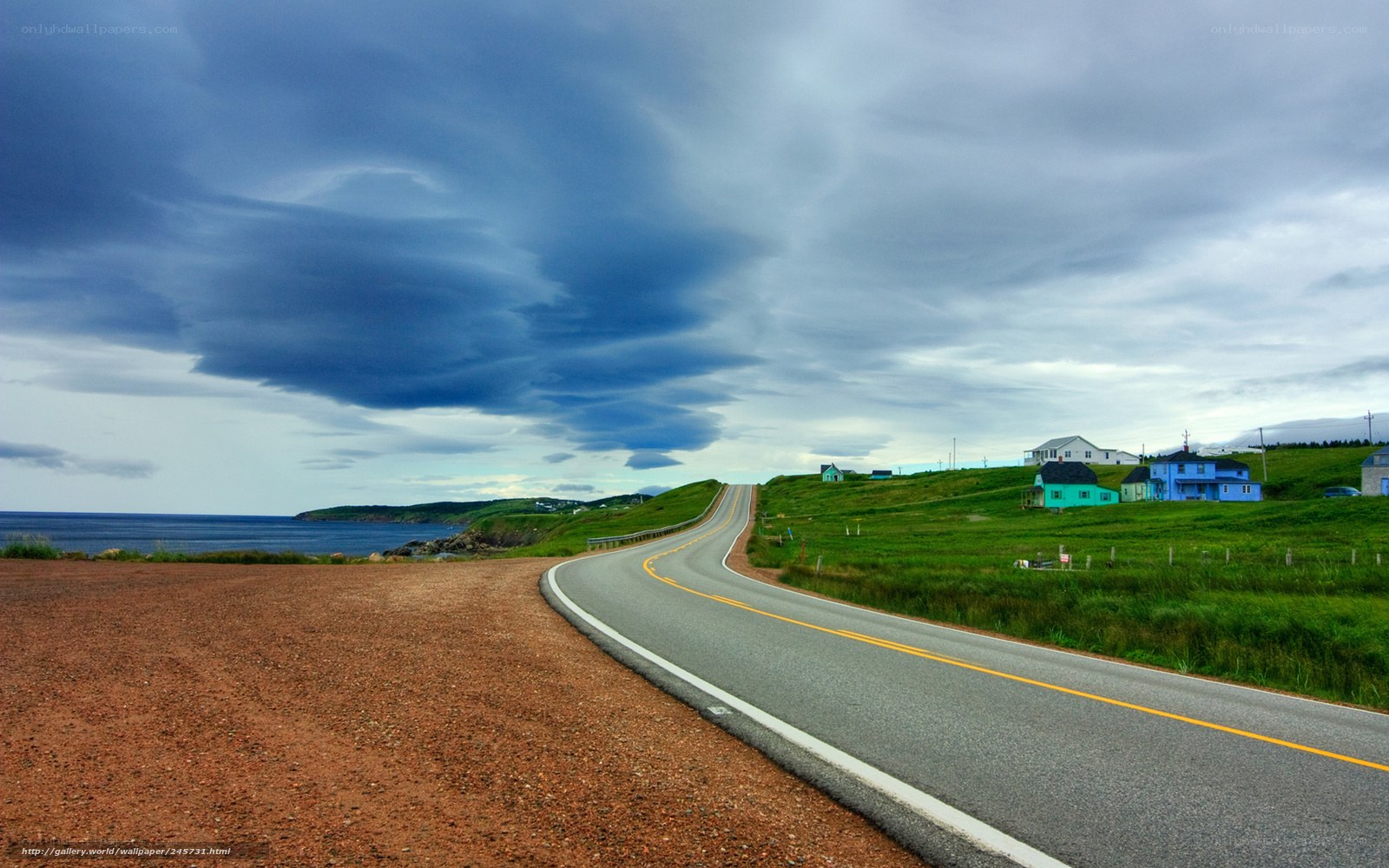 Coastal road under stormy sky