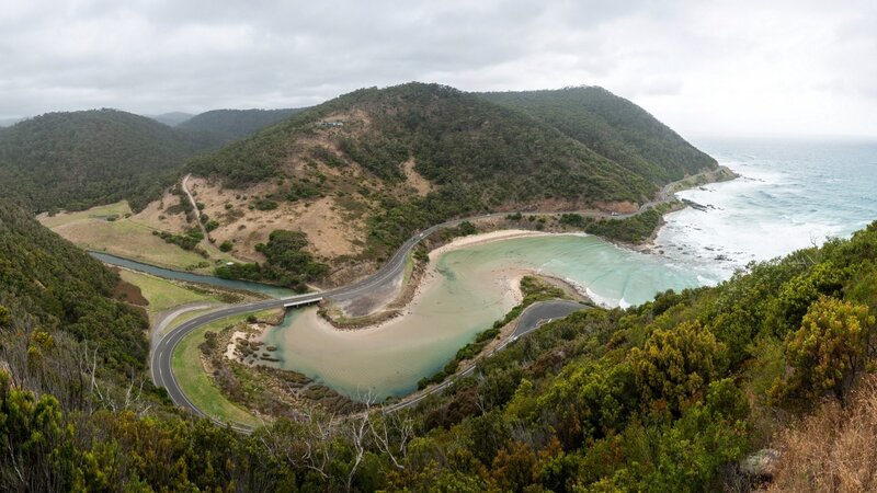 coastal road winding through green hills