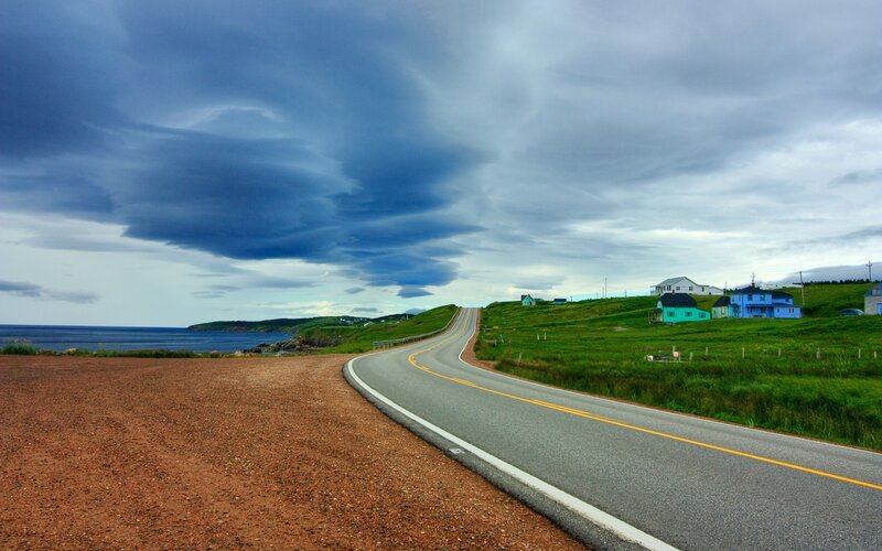Coastal road with colorful houses
