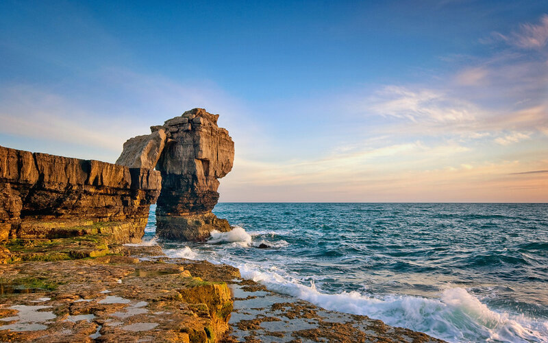 Coastal rock formation at sunset