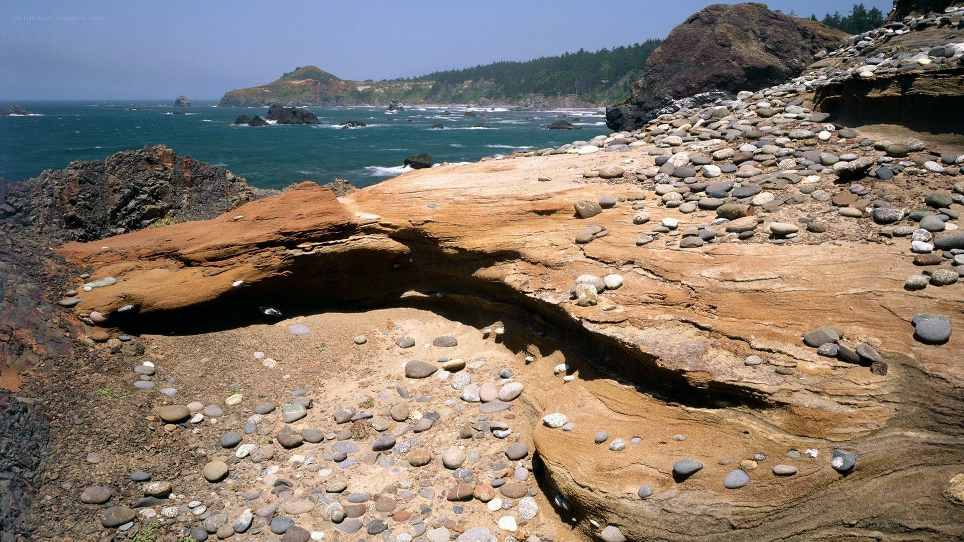 coastal rock formations and pebbles
