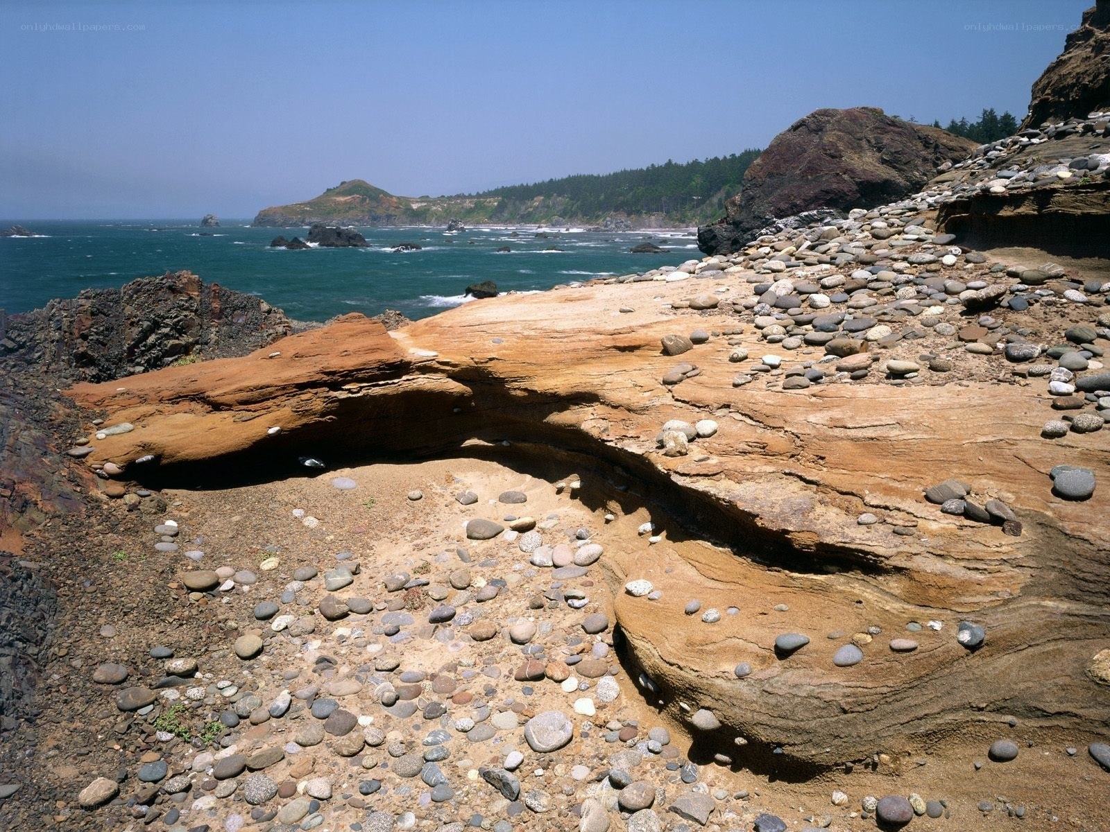 coastal rock formations and pebbles