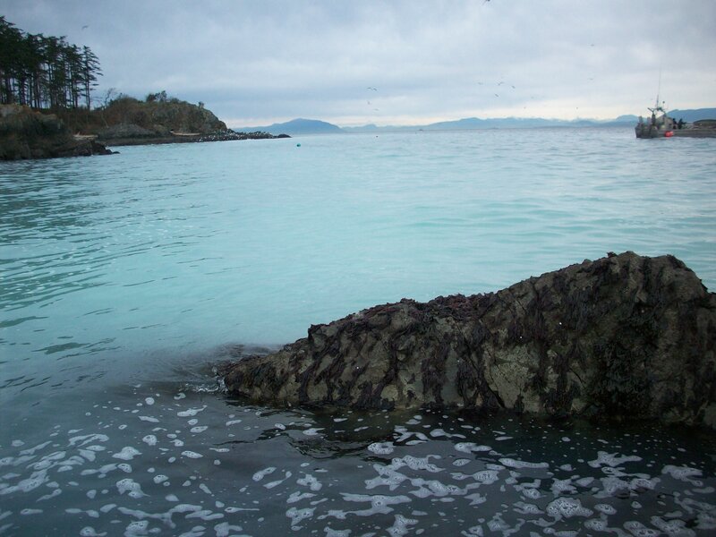 coastal rocks and fishing boat