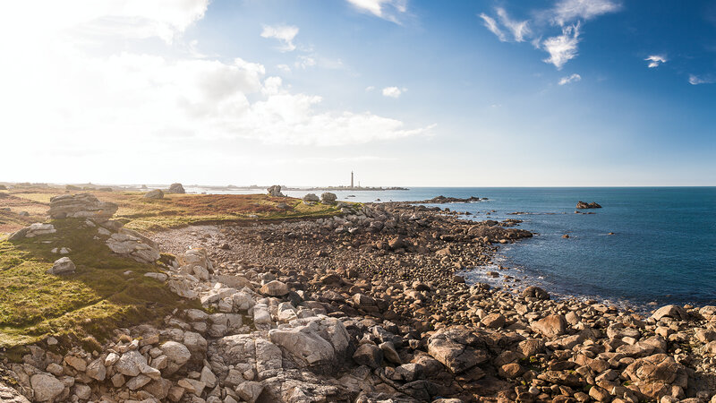 Coastal Rocks and Lighthouse — Blue
