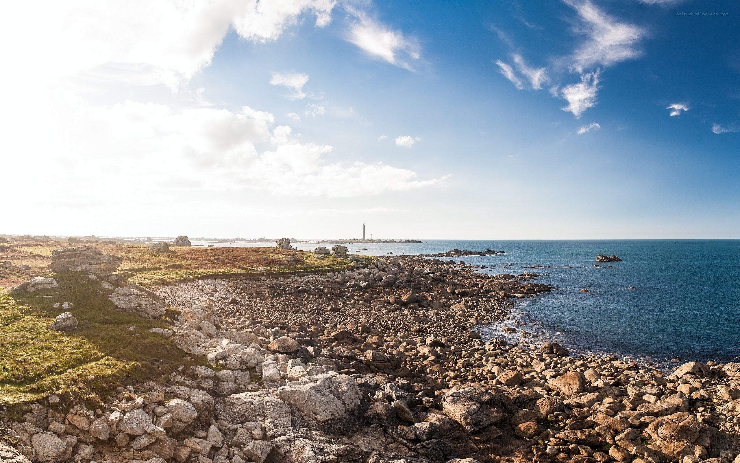 coastal rocks and lighthouse