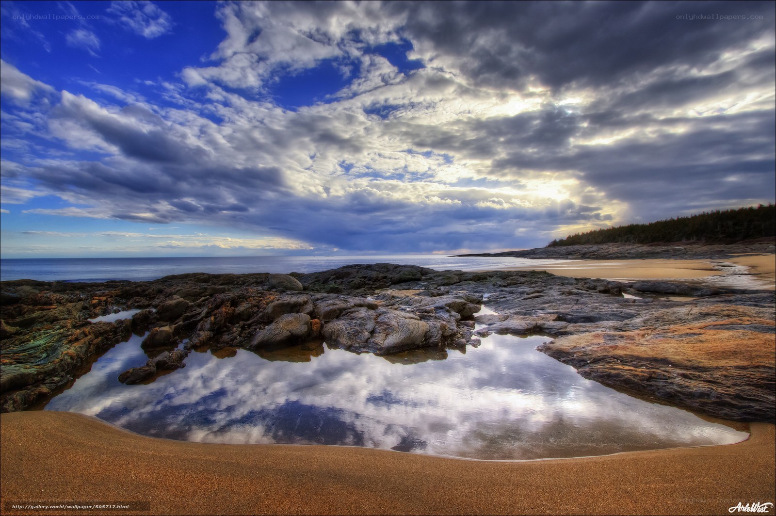 Coastal rocks and sky reflection