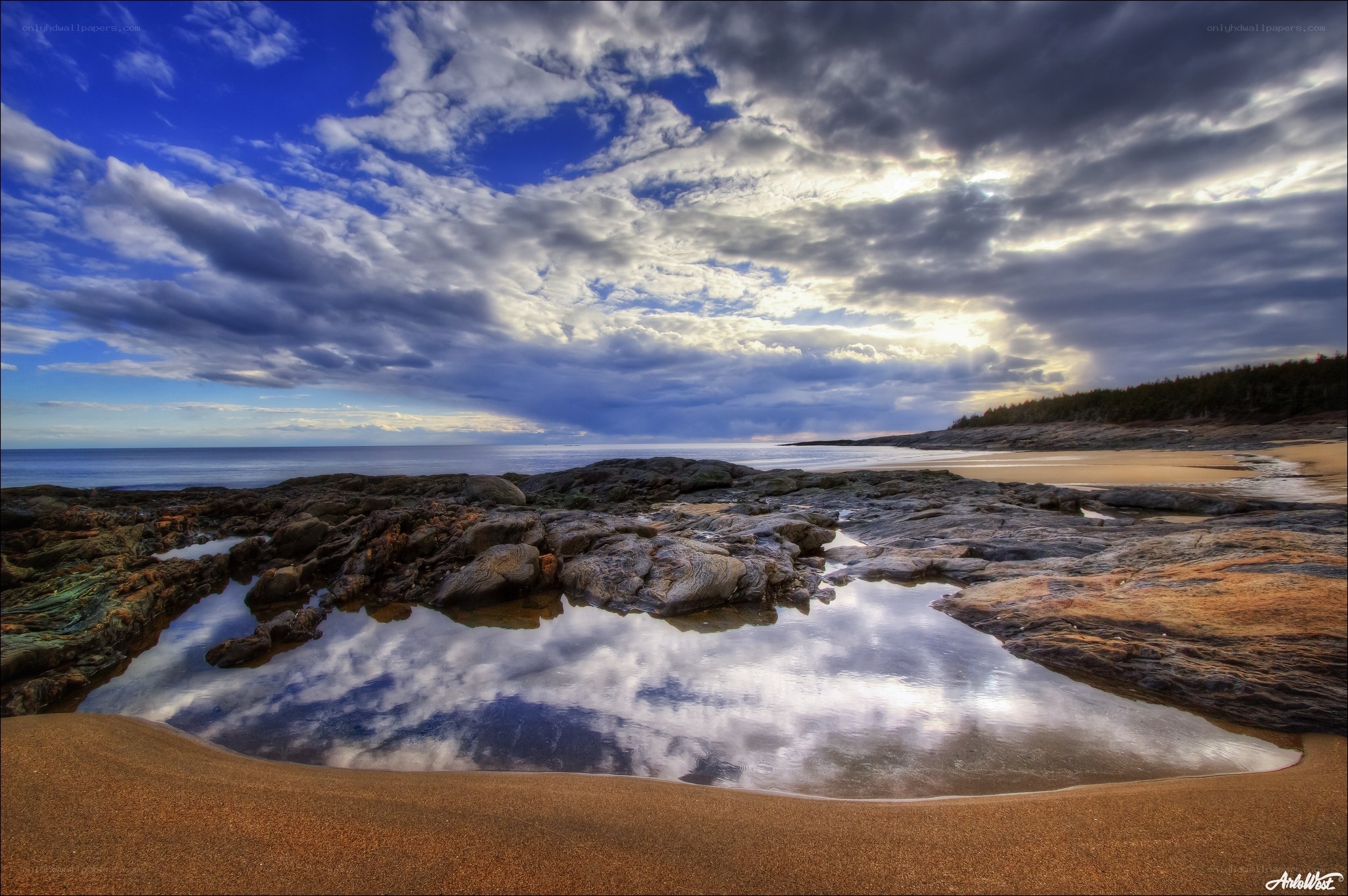 Coastal rocks and sky reflection