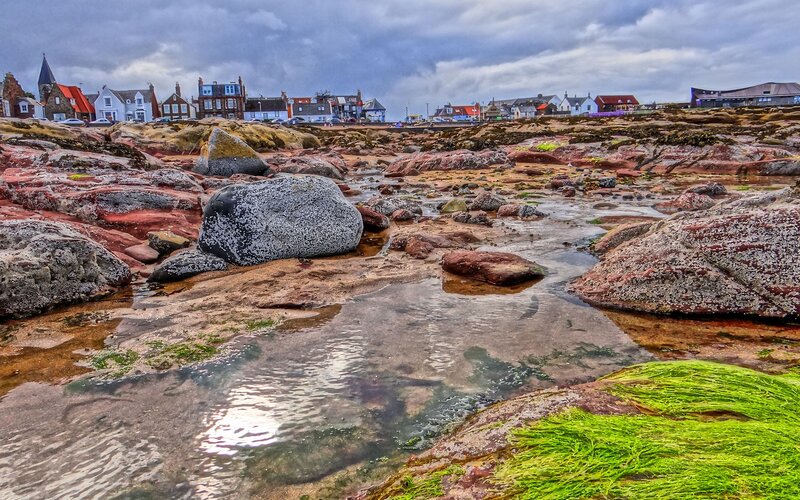 coastal rocks and village view