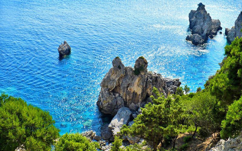 Coastal rocks in blue sea