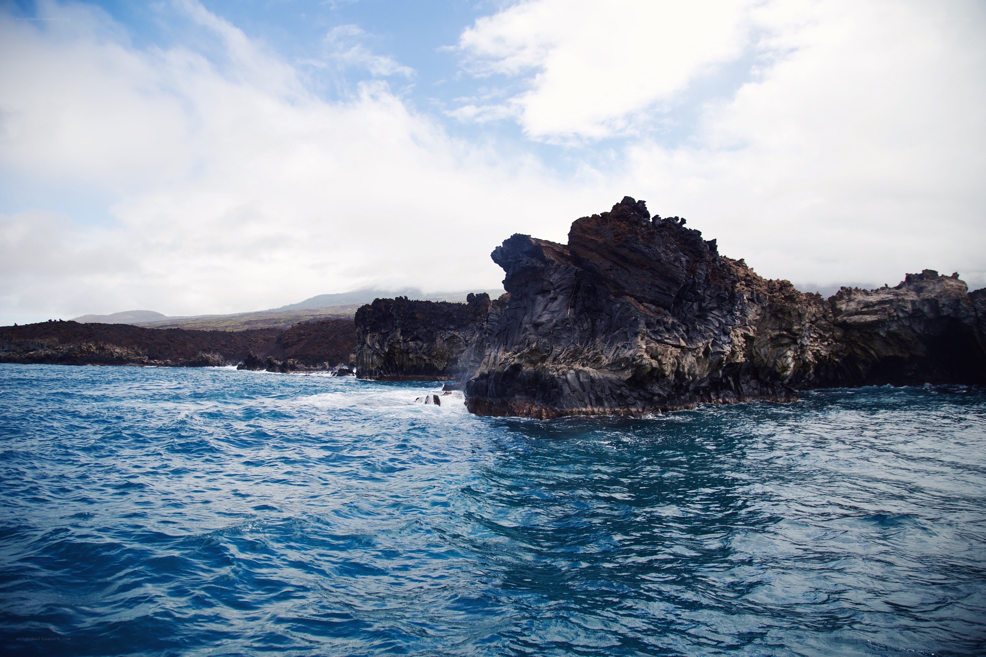 coastal rocks in blue water
