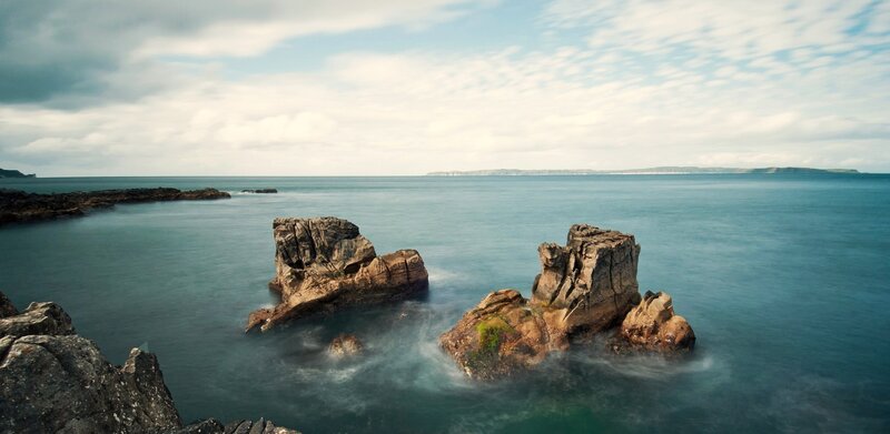 coastal rocks in calm sea