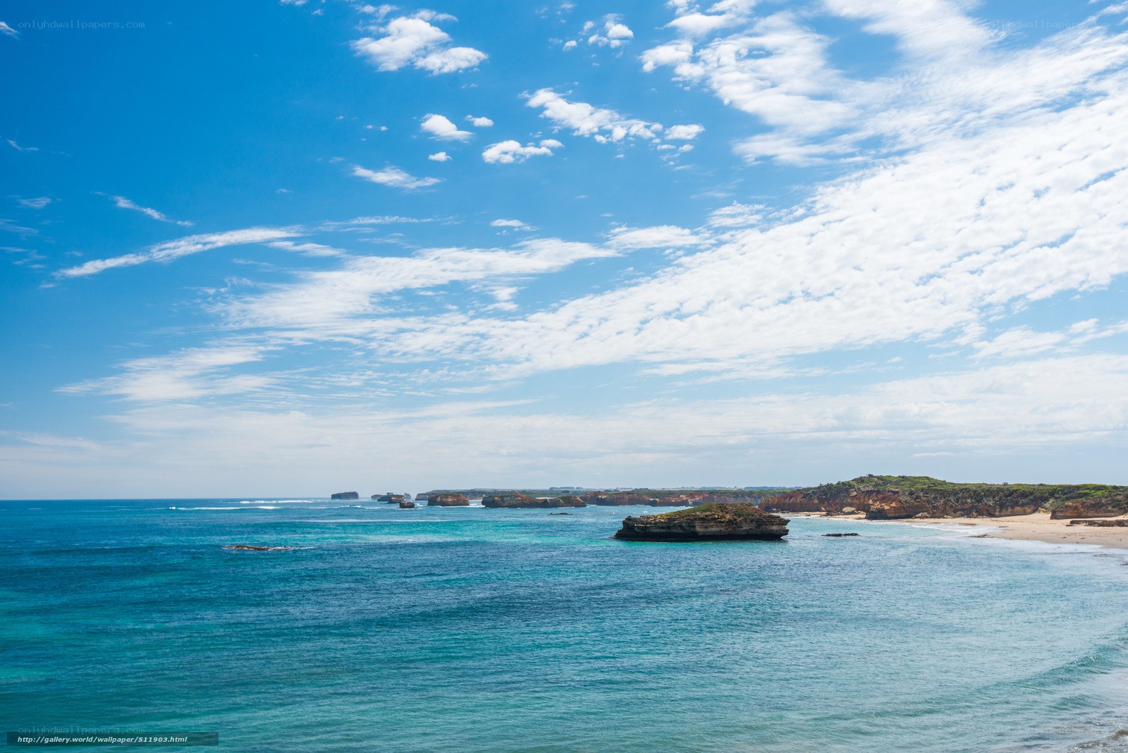 coastal rocks under blue sky