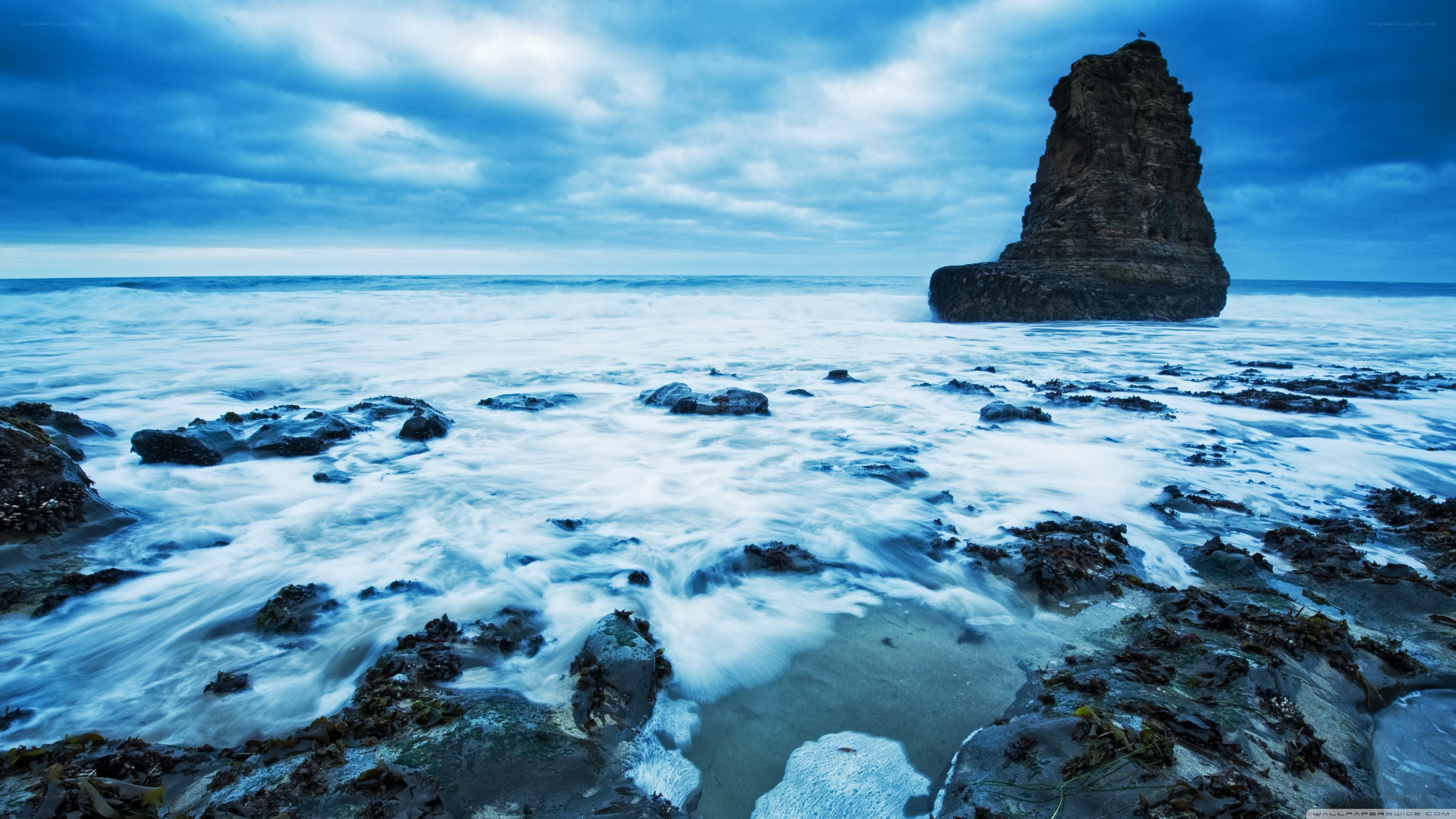 coastal rocks under stormy sky