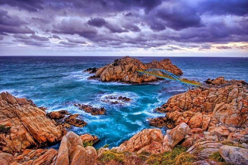 Coastal rocks with blue bridge