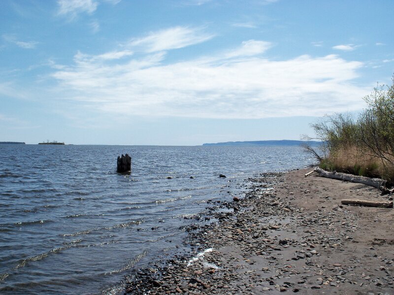 coastal shoreline with wooden post