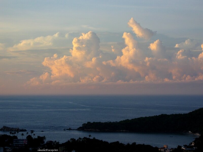 coastal sunset with cumulus clouds