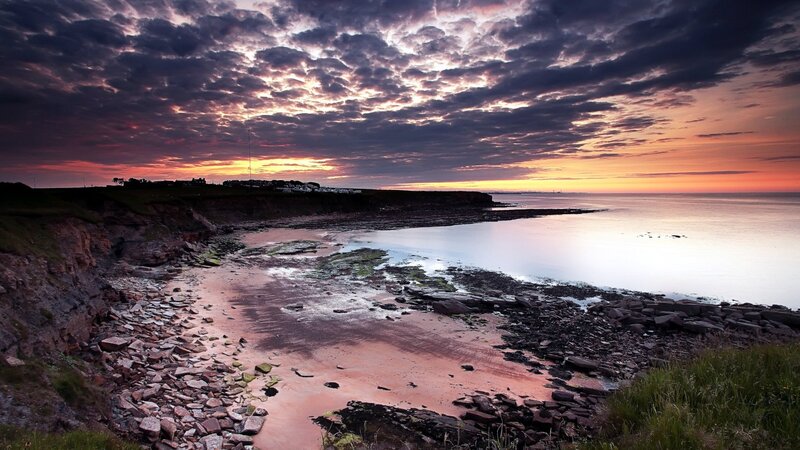 coastal sunset with rocky shore