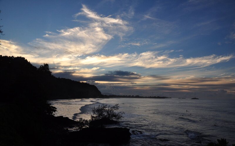 coastal sunset with silhouetted hills