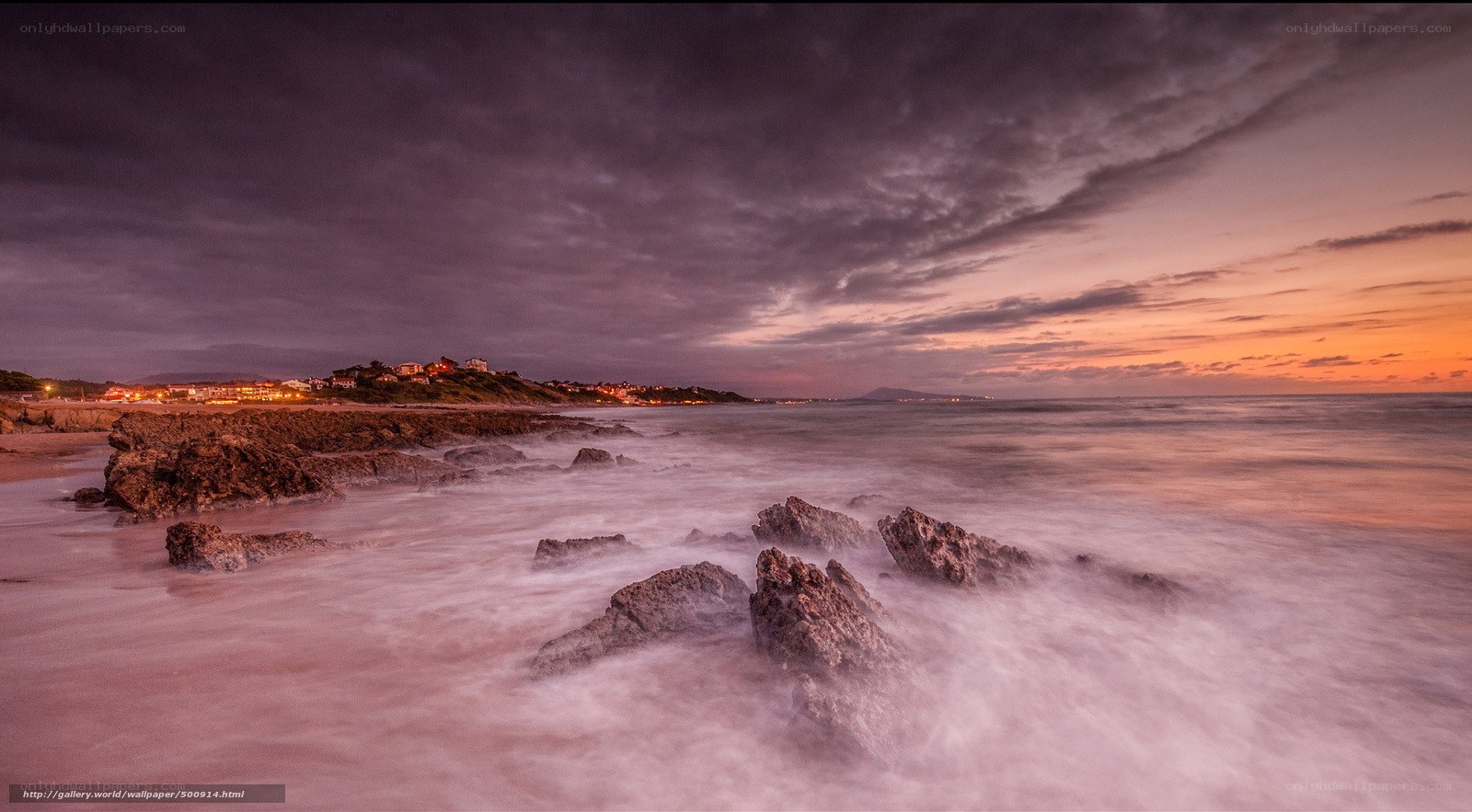 coastal sunset with town