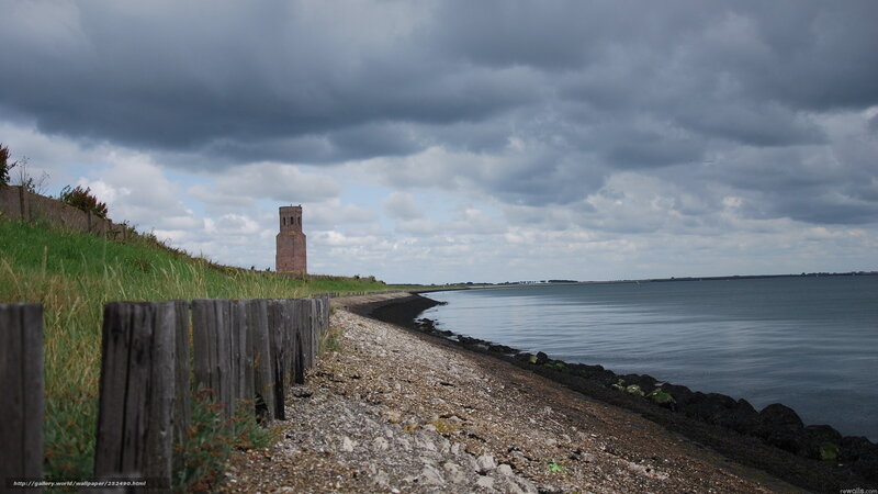 coastal tower under cloudy sky