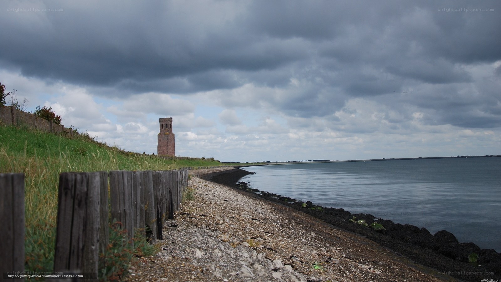 coastal tower under cloudy sky