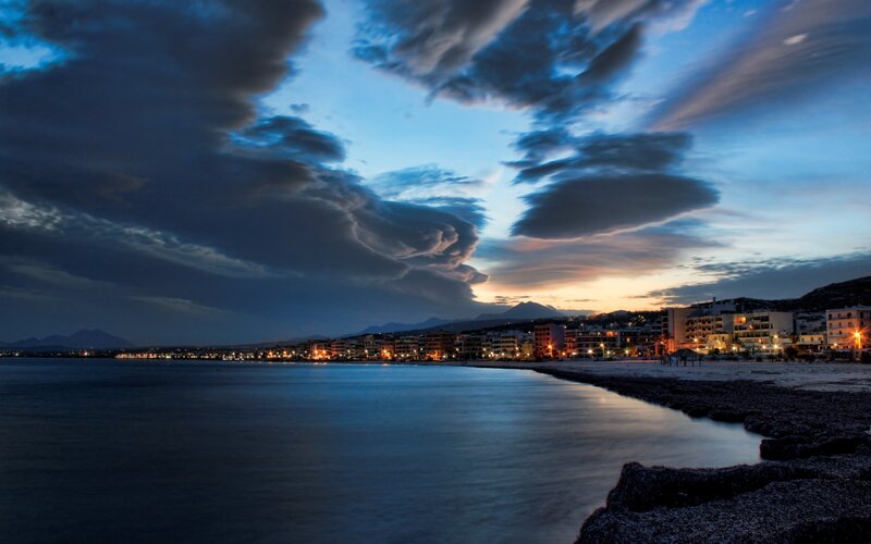 Coastal Town at Dusk — Blue, Dramatic, Night, Photograph, Beach