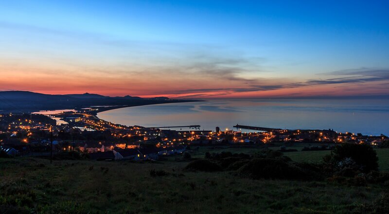 Coastal Town at Dusk — Blue, Serene, Sunset, Photograph, Sea