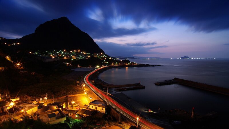 Coastal Town at Night — Blue, Dramatic, Photograph, Mountain, Road, Sea