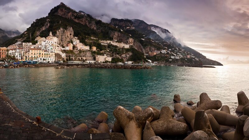 Coastal Town on Cliff — Blue, Dramatic, Sunset, Photograph, Mountain, Sea, Buildings