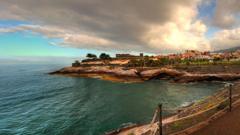 Coastal Town on Cliff — Blue, Dramatic, Sunset, Photograph, Ocean