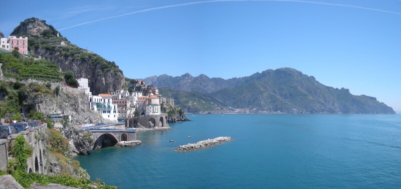 Coastal Town on Cliff — Blue, Serene, Afternoon, Photograph, Mountains, Sea