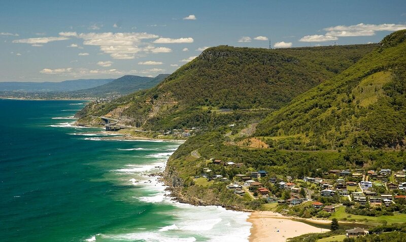 Coastal Town on Cliff — Blue, Serene, Afternoon, Photograph, Ocean