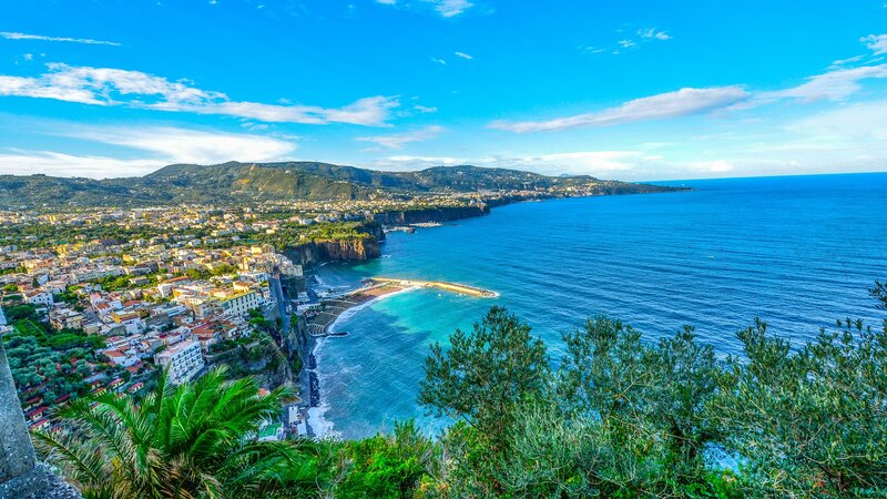 Coastal Town on Cliff — Blue, Serene, Afternoon, Photograph, Sea