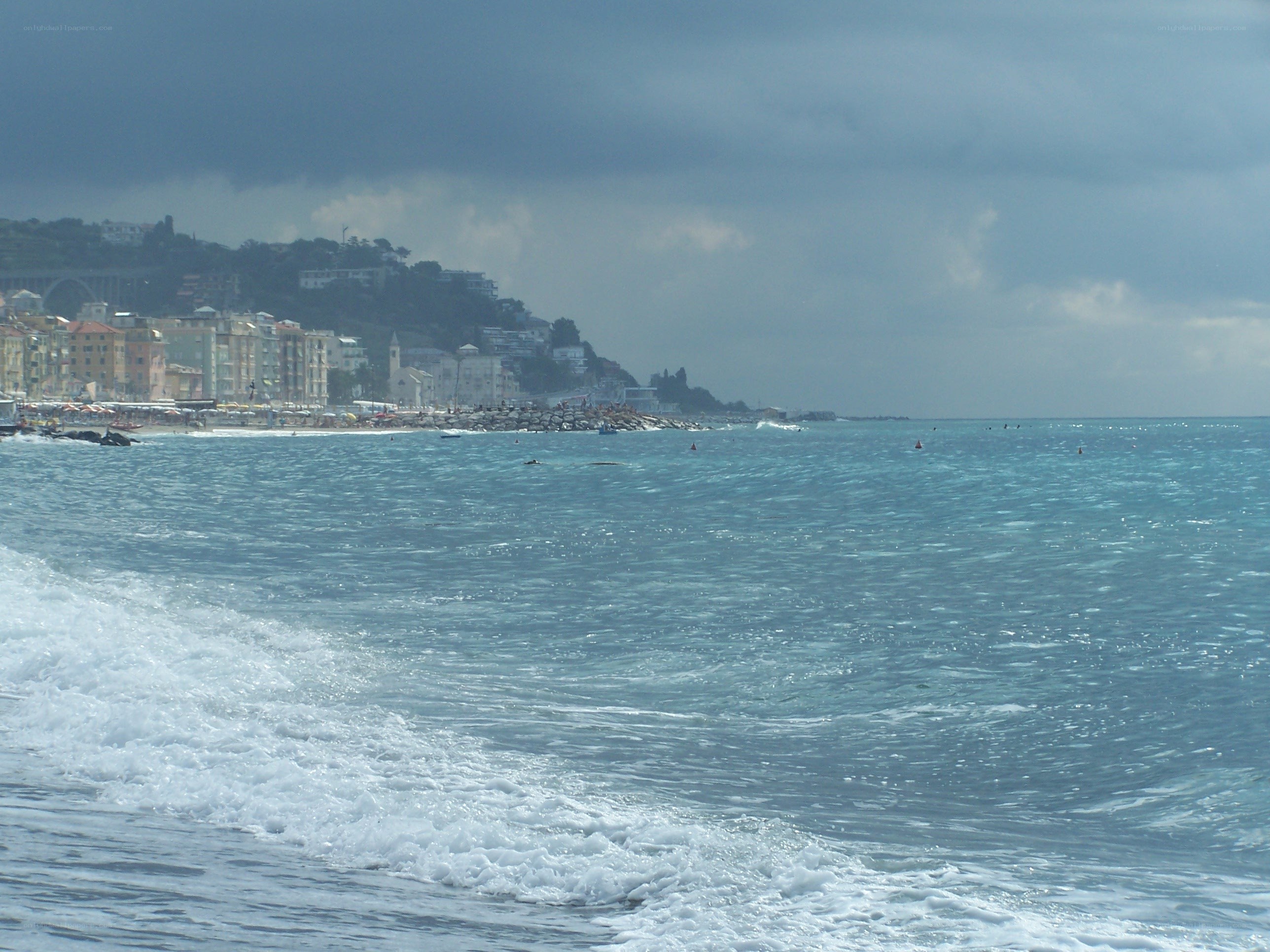 coastal town under cloudy sky