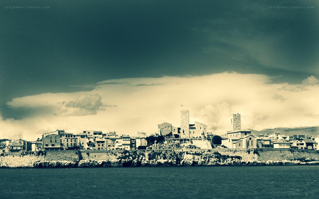 coastal town under stormy sky